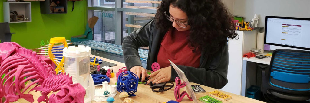 Sabrina testing a 3D print in the IgnitED lab.