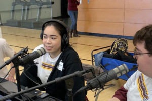 3 podcasters with headphones on