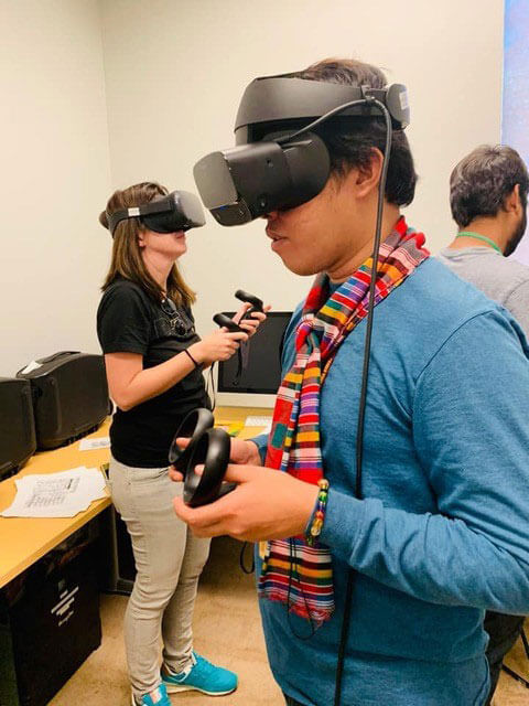 Fullbright fellows wearing VR goggles