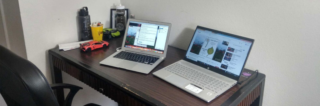 A desk with two laptops