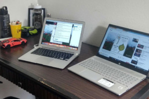 A desk with two laptops