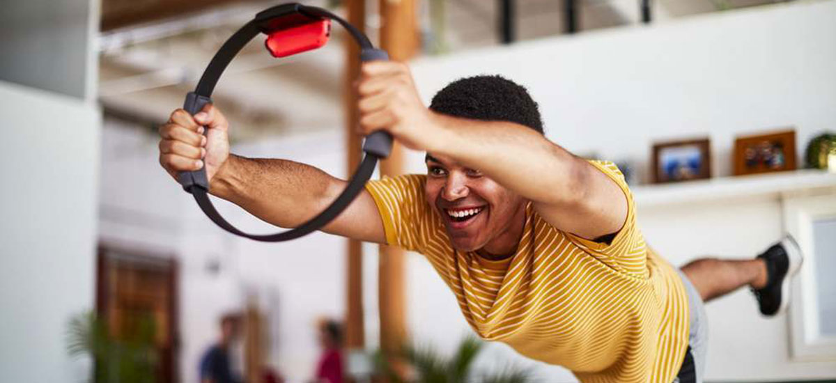 A kid leaping through the air with a Nintendo RingFit. Please don't try this at home.